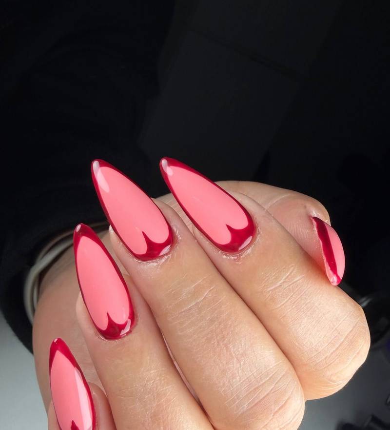 Pink almond nails with deep-red tips and cuticle detail — by Alice Garrido